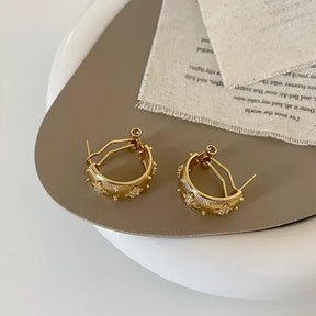 Brinco Chama Estrelada – Design Vintage com Zircônia